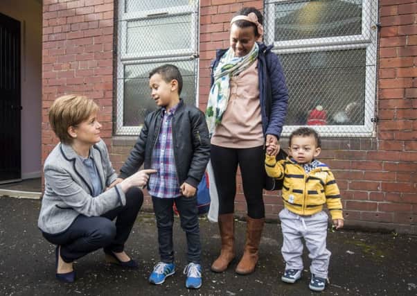 Nicola Sturgeon meets visitors to Home-Start in Glasgow. The organisation offers support to young families. Photograph: PA