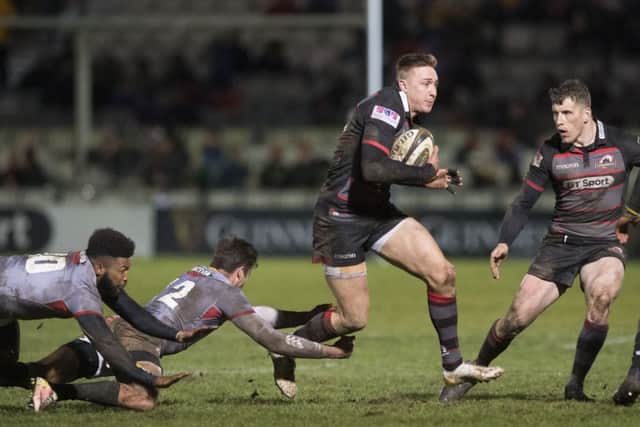 Edinburgh winger Dougie Fife, scorer of the fifth try, evades the Southern Kings tacklers
