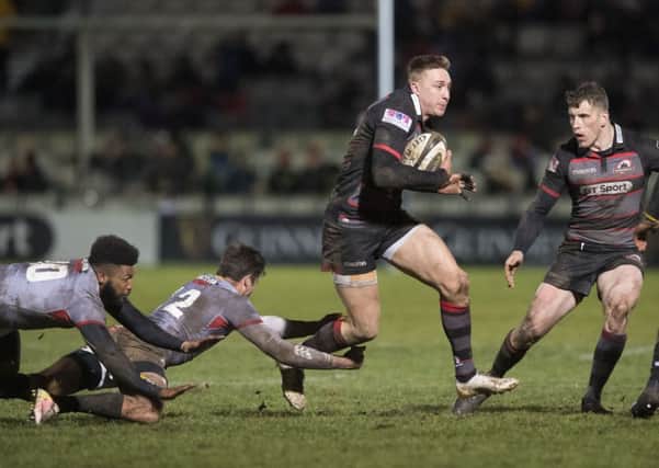Edinburgh winger Dougie Fife, scorer of the fifth try, evades the Southern Kings tacklers