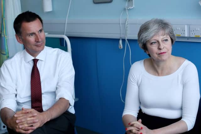 Theresa May and Health Secretary Jeremy Hunt issued their own half-hearted apologies. Picture: Getty