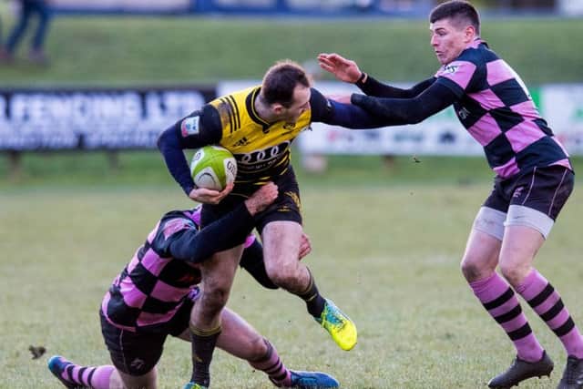 Melrose's Nyle Godsmark is tackled by Ayr's Stafford McDowall and Scott Lyle. Picture: Ross Parker/SNS