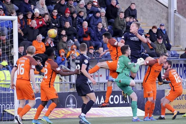 Peter Grant rises to head in Falkirk's first goal in the 6-1 win over Dundee United. Picture: Michael Gillen