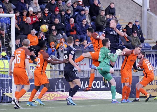 Peter Grant rises to head in Falkirk's first goal in the 6-1 win over Dundee United. Picture: Michael Gillen