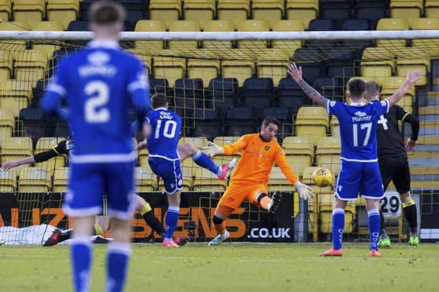 Chris Kane scores the winner for Queen of the South. Picture: Bruce White/SNS