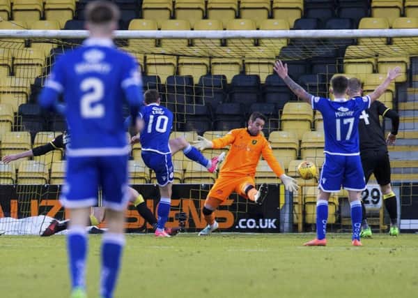 Chris Kane scores the winner for Queen of the South. Picture: Bruce White/SNS