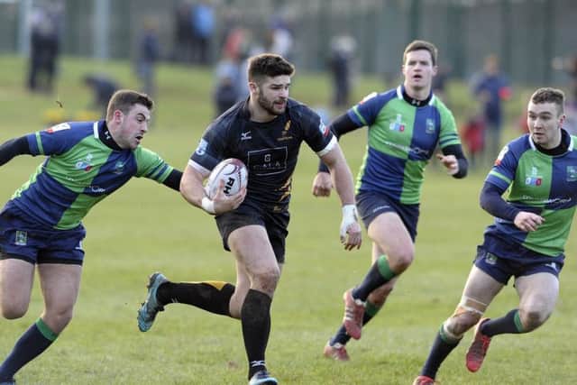 Robbie Nelson of Currie on the run against Boroughmuir. Picture: Neil Hanna