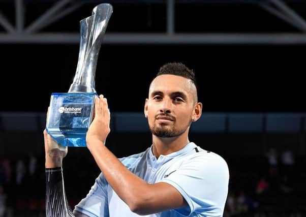 Nick Kyrgios holds the trophy after winning the Brisbane International. Picture: Getty