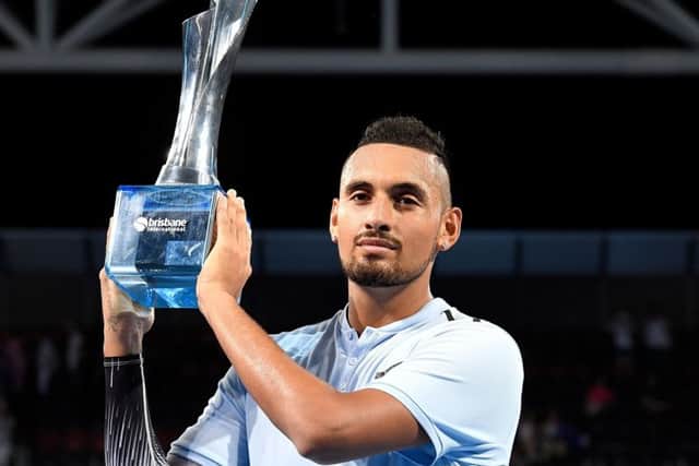 Nick Kyrgios holds the trophy after winning the Brisbane International. Picture: Getty