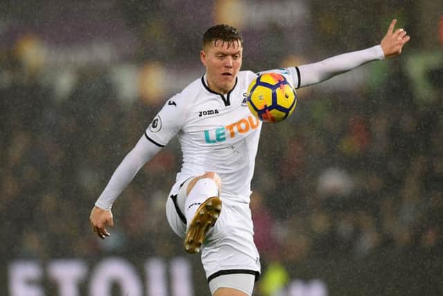 Alfie Mawson in action for Swansea. The defender has been linked with several clubs. Picture: Getty Images