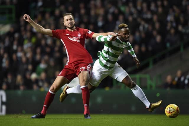 Kari Arnason competes with Celtic's Moussa Dembele. Picture: SNS Group