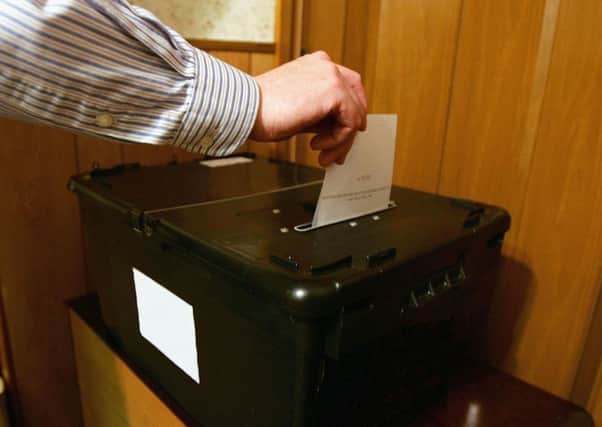MSPs are considering ending the blanket ban on prisoners voting in Scottish elections