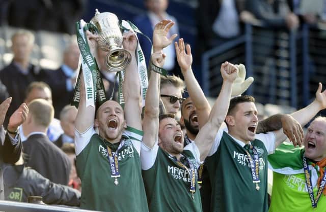 David Gray lifts the Scottish Cup at Hampden in May 2016. Picture: Neil Hanna.