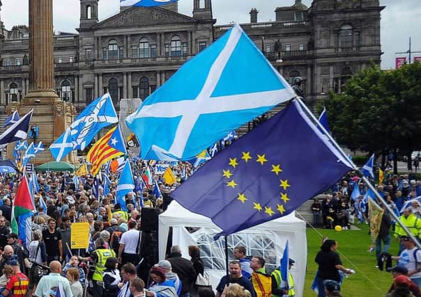Pro-independence supporters with Saltires and EU flags (Picture: AFP/Getty)