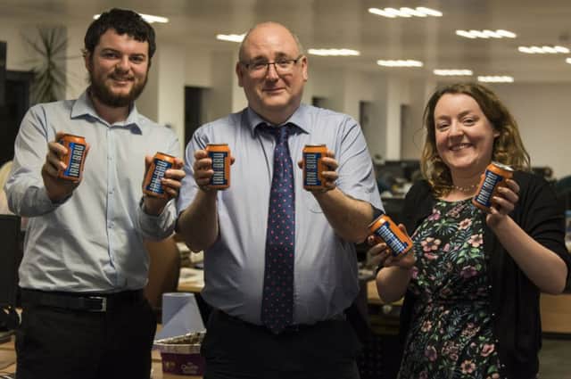 The Scotsman Irn-Bru Taste Test Team. From left to right, James Delaney, Brian Ferguson and Florence Snead try out the new low sugar version of Barr's Irn-Bru.