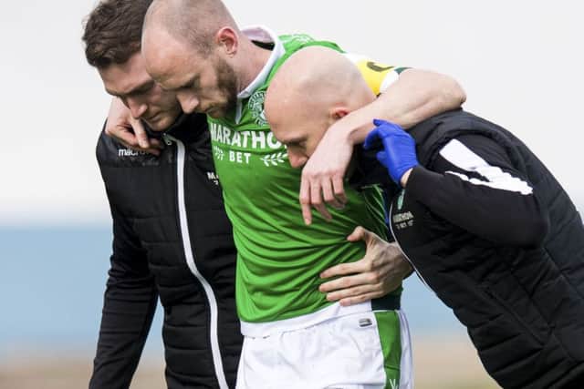 David Gray had to be helped from the field