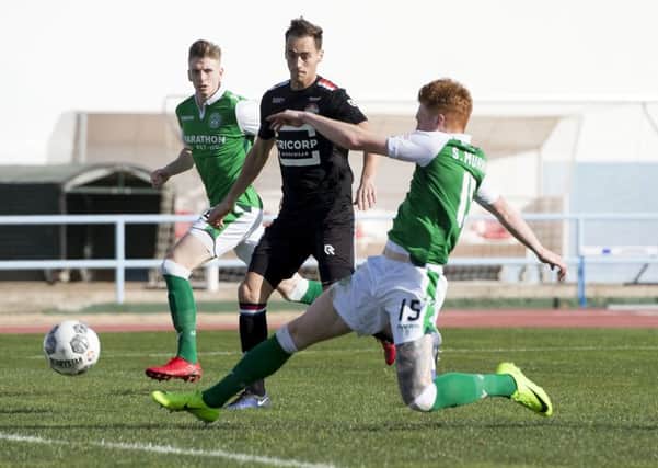 Simon Murray fires Hibs into the lead against Dutch side Willem II yesterday, but they went on to lose the friendly match 3-1. Picture: SNS.