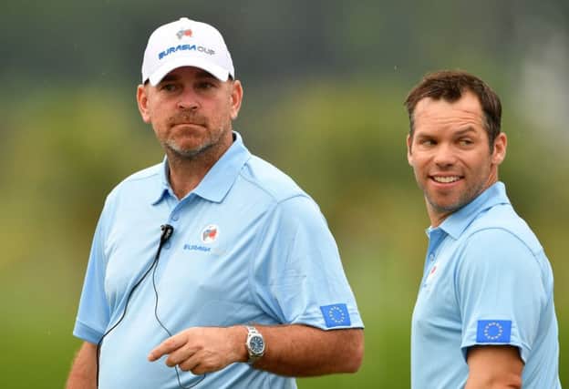 Paul Casey, right, has marked his return to the European fold by winning both his matches so far for captain Thomas Bjorn in Malaysia. Picture: Getty Images