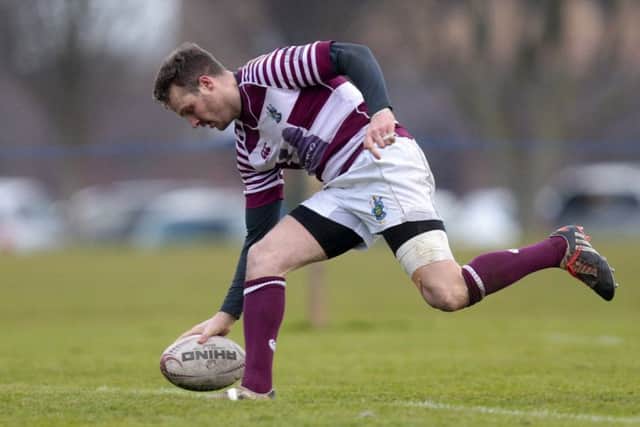 Rory Hutton touches down to put Watsonians ahead during a topsy-turvey first half yesterday. Photograph: Graham Stuart/SNS