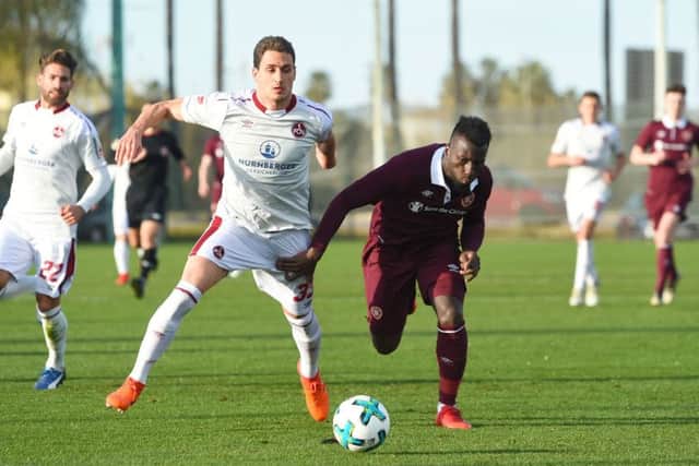 Hearts' Esmael Goncalves, right, competes with Nurnberg's Georg Margreitter. Picture: Craig Foy/SNS