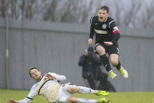 St Mirrens Stephen McGinn eludes Tom Walshs challenge. Picture: SNS.