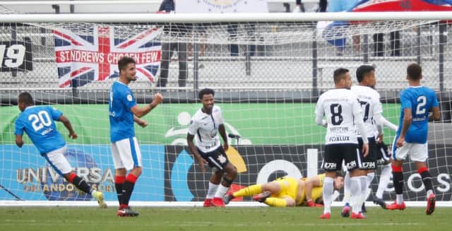 Alfredo Morelos, left, turns aways after scoring for Rangers during their second-half blitz of Brazilian champions Corinthians. Picture: AFP/Getty.