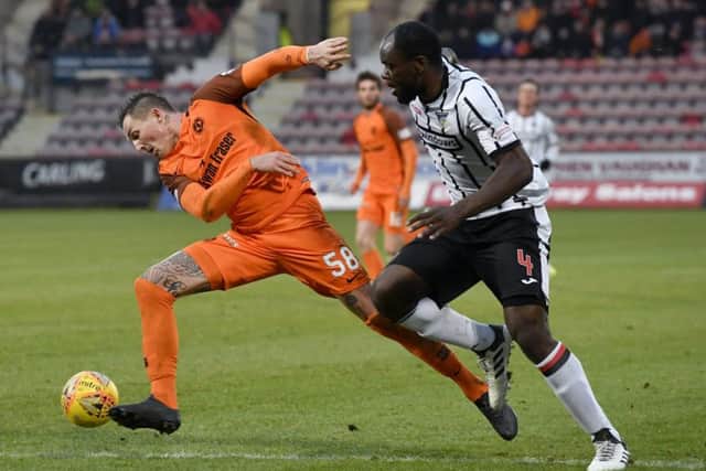 Dundee United's Emil Lyng tussles with Jean Yves Mvoto of Dunfermline. Picture: SNS.