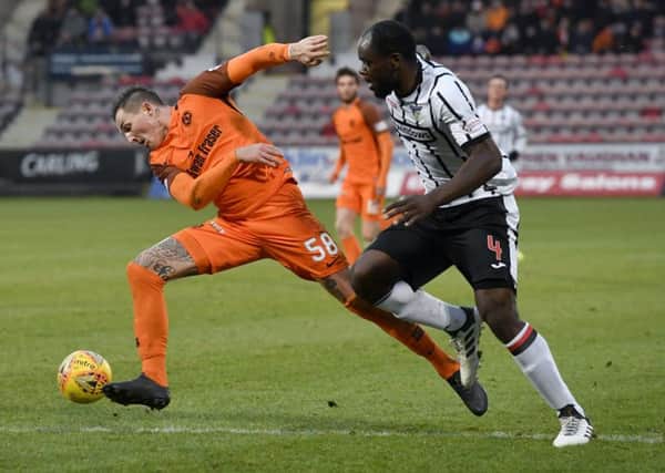 Dundee United's Emil Lyng tussles with Jean Yves Mvoto of Dunfermline. Picture: SNS.