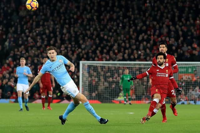 Mohamed Salah scores Liverpools fourth goal with a long-range shot in their 4-3 victory over Manchester City. Picture: PA.