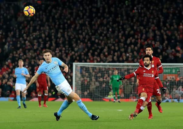 Mohamed Salah scores Liverpools fourth goal with a long-range shot in their 4-3 victory over Manchester City. Picture: PA.