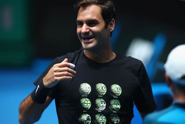 Roger Federer in good spirits during a practice session as he chases an unprecedented 20th grand slam title. Picture: Getty.