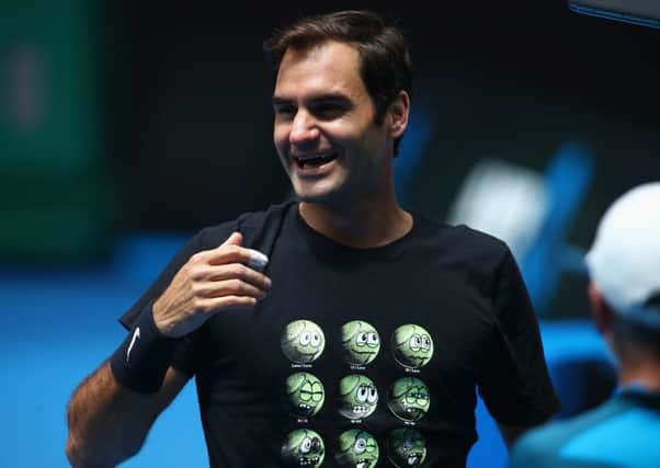 Roger Federer in good spirits during a practice session as he chases an unprecedented 20th grand slam title. Picture: Getty.