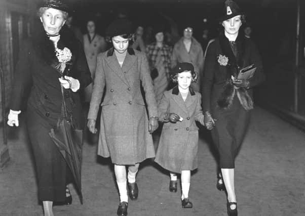 Princess Elizabeth and Princess Margaret with Lady Helen Graham and Miss Marion Crawford (right) ) after their first ride on the Underground in 1939. (PIC: Getty Images).