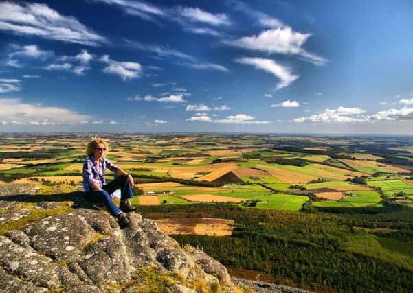 A walker enjoys the view from Bennachie in Aberdeenshire. PIC: Creative Commons/Flickr /Gordon Robertson.