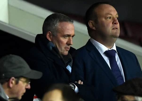 New Stoke manager Paul Lambert watches from the Old Trafford stand last night. Picture: Getty