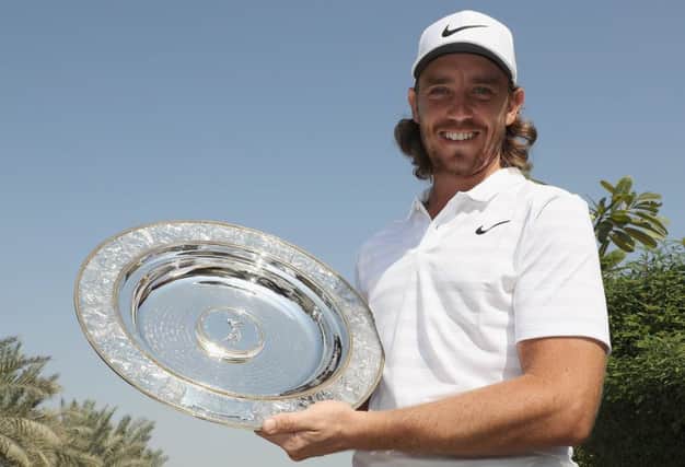 Tommy Fleetwood shows off the Seve Ballateros Awatd, the players' player of the year prize on the European Tour. Picture: Getty Images