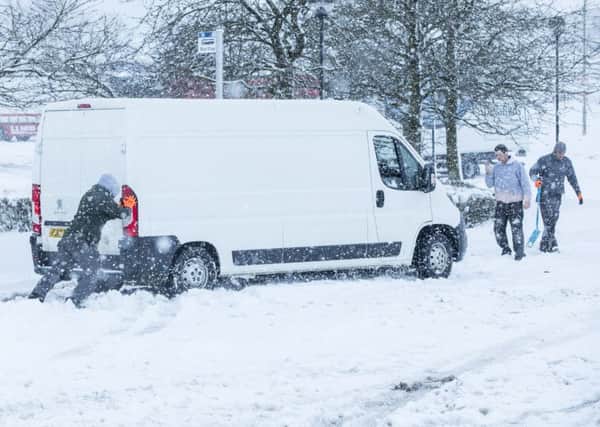 Heavy snow hits Scotland for the second day causing travel problems, many cars becoming stuck on at Abington Service Station on M74. Picture: SWNS