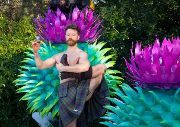Kilted Yoga star Finlay Wilson raises a glass to the bard at the Giant Lanterns of China trail where Burns Night will be celebrated next week. PIC: Contributed.