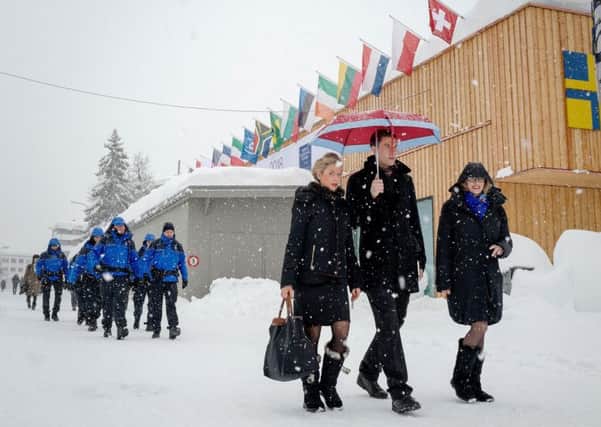 The rich and powerful descend on Davos this week, but how many are true idealists? (AFP PHOTO / Fabrice COFFRINIFABRICE COFFRINI/AFP/Getty Images)