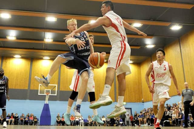 Jonny Bunyan, left, in action for Glasgow Rocks against Falkirk Fury. Picture: Michael Gillen
