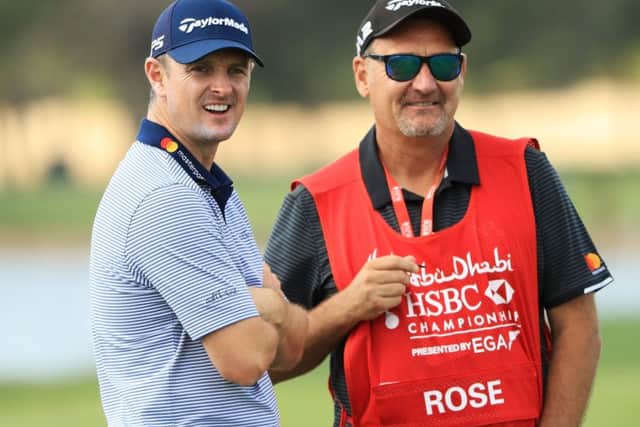 Justin Rose, left, and his caddie Mark Fulcher during the pro-am prior to the Abu Dhabi HSBC Golf Championship. Picture: Andrew Redington/Getty Images