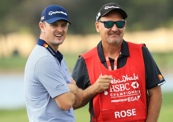 Justin Rose, left, and his caddie Mark Fulcher during the pro-am prior to the Abu Dhabi HSBC Golf Championship. Picture: Andrew Redington/Getty Images