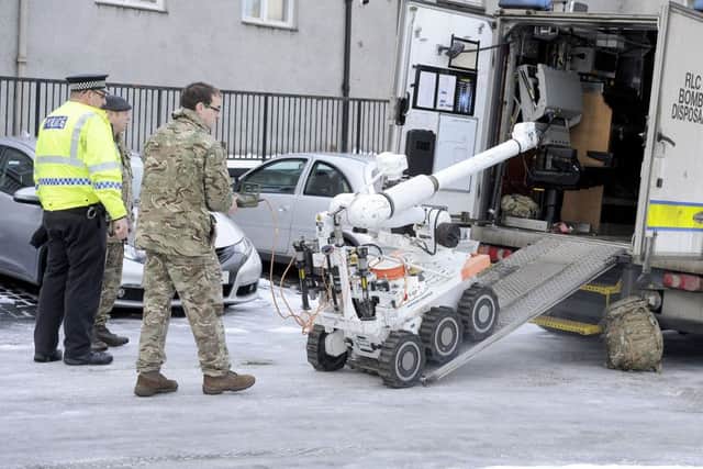 The bomb disposal squad deployed specialist equipment during the incident. Picture: Michael Gillen.