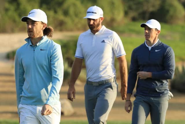 Rory McIlroy had Tommy Fleetwood and Dustin Johnson for company today in the first round of the Abu Dhabi HSBC Championship. Picture: Getty Images