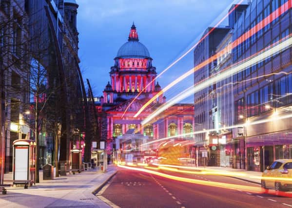 Bustling Belfast at night, with the elegant City Hall. Photograph: Getty/iStockphoto