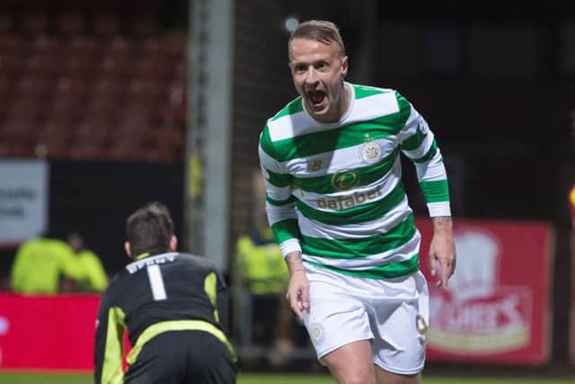 Leigh Griffiths wheels away after he makes it 2-1. Picture: SNS
