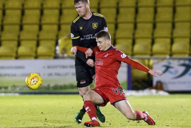 Falkirks Andrew Nelson, right, battles Alan Lithgow of Livingston. Picture: SNS.