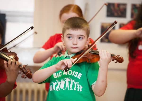Children perform at Big Noise in Govanhill, but music tuition is facing major cuts across Scotland. Picture: John Devlin