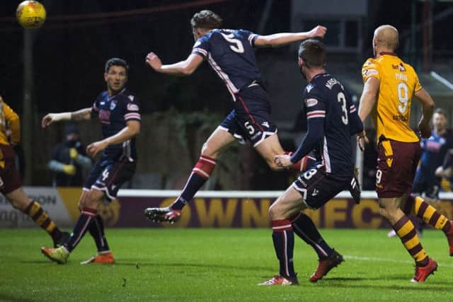 Harry Souttar headers the ball into the back of his own net. Picture: SNS