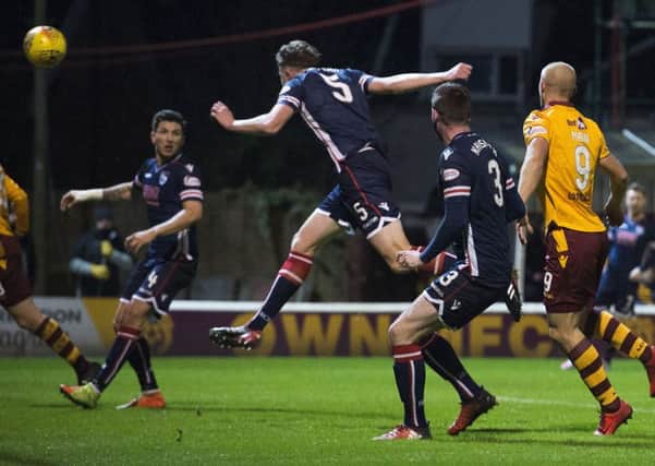 Harry Souttar headers the ball into the back of his own net. Picture: SNS