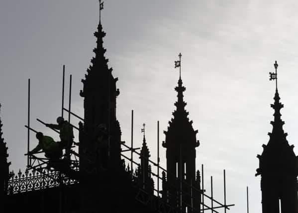Workers put up scaffolding on the Palace of Westminster (Picture: AFP/Getty)